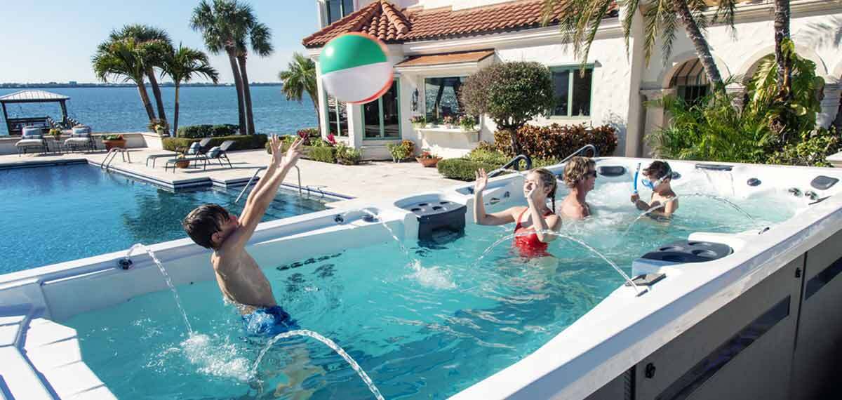 Phelps and Family in a swim spa.