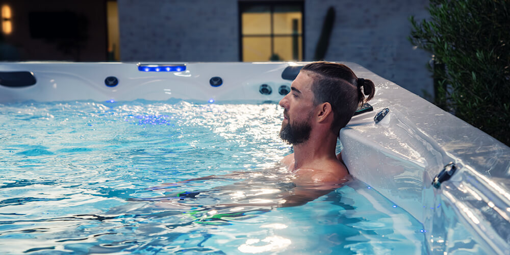 Michael Phelps relaxing in a swim spa.